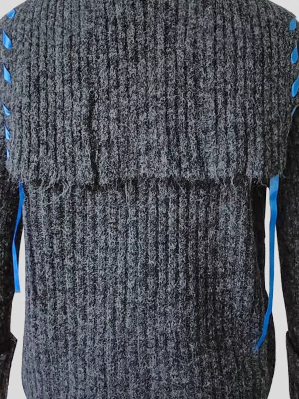Gray ribbed knit cardigan back panel texture with blue trim accents