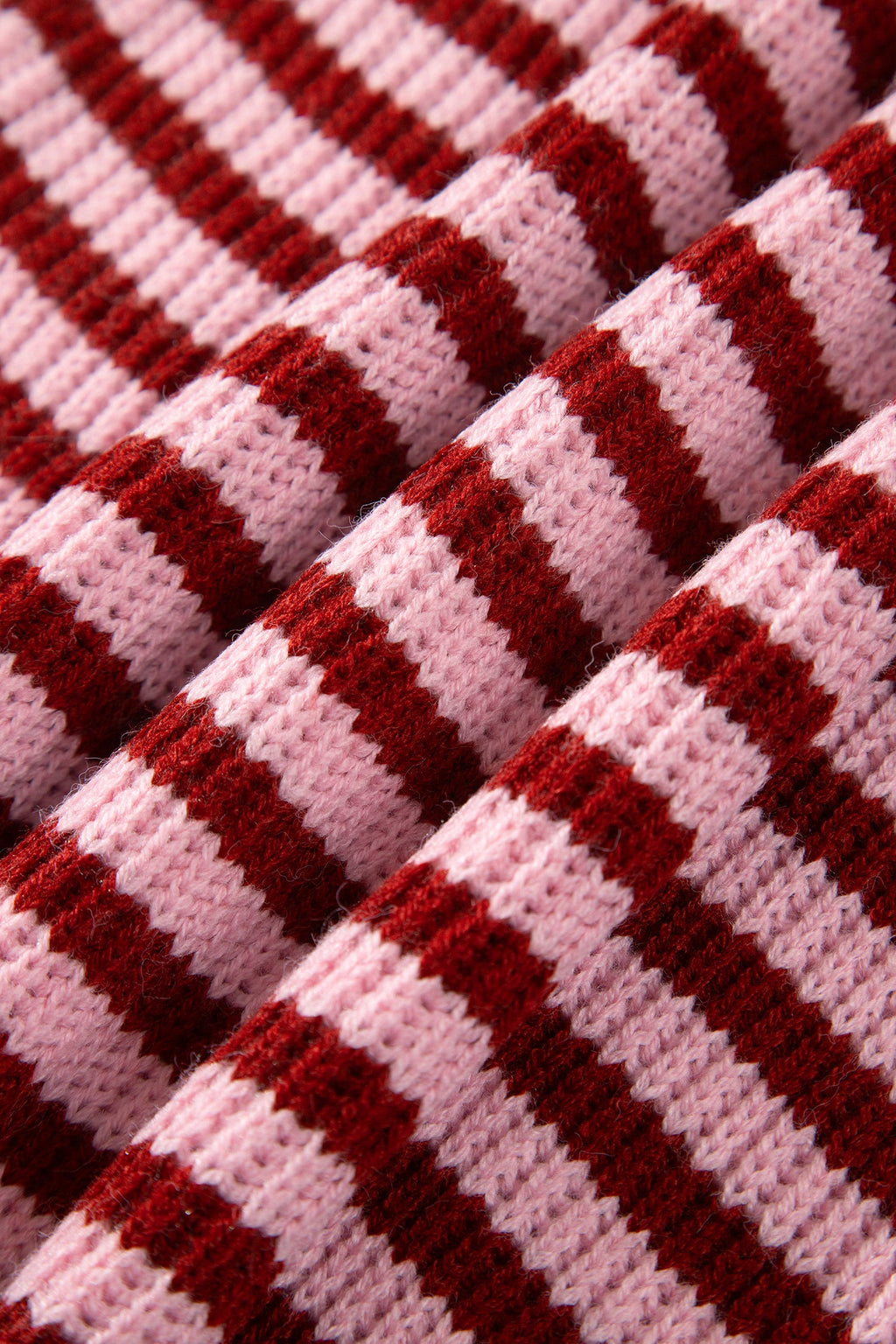 Red and white striped knit fabric texture close-up