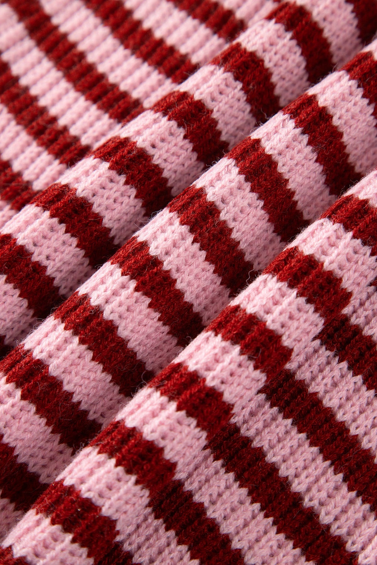Red and white striped knit fabric texture close-up