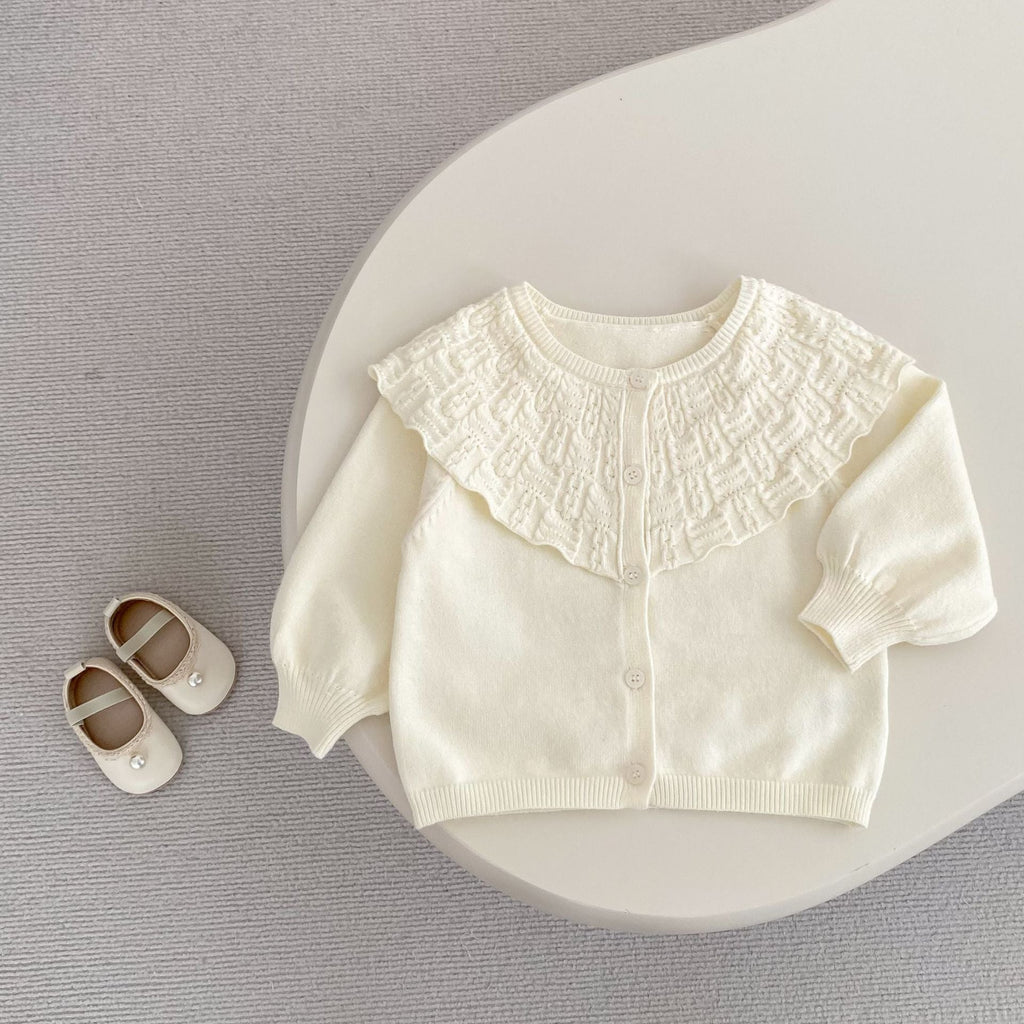 Cream baby knitted cardigan coat with large ruffled lapel and button-front