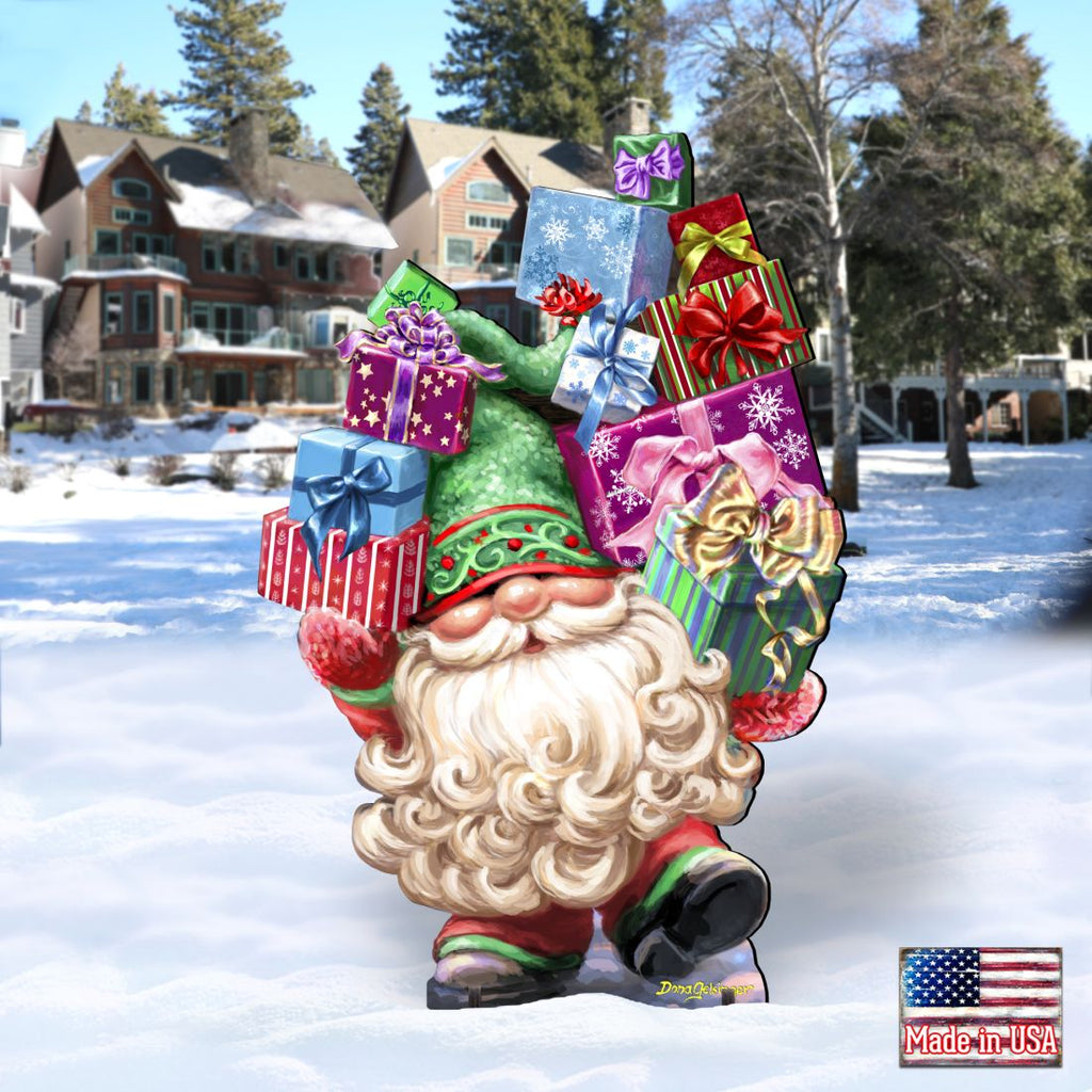 Holiday gnome yard decor holding colorful gift boxes, green hat, white beard