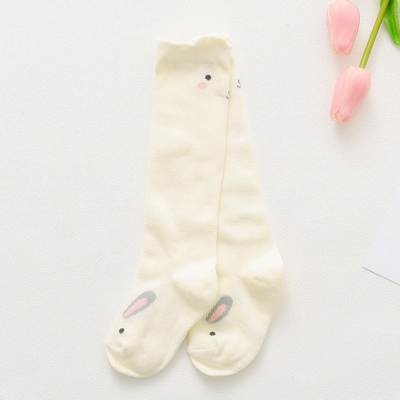 Cream children’s cartoon animal socks with small pink face details at toe and cuff