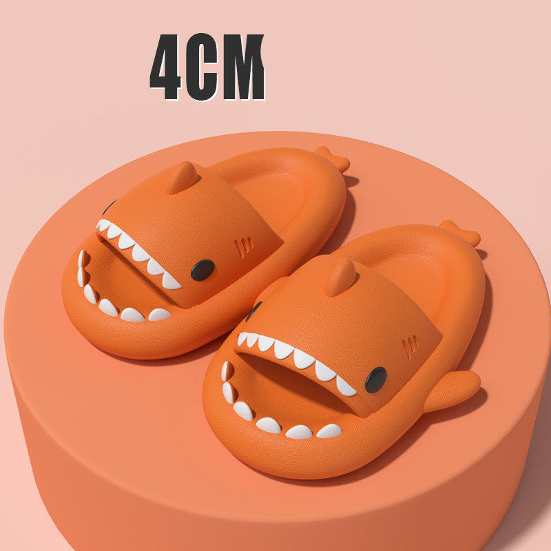 Orange shark-shaped slide sandals with open toe and white tooth border