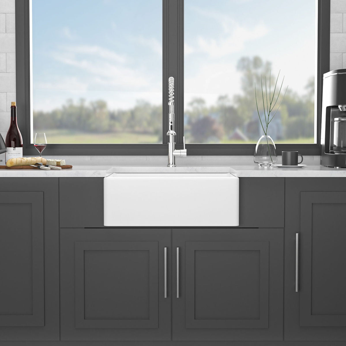 White ceramic single-bowl apron front sink centered in a kitchen countertop