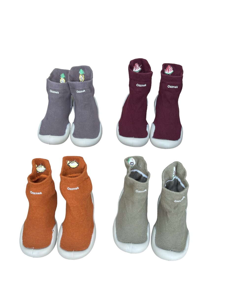 Assorted knitted barefoot sock shoes with colorful fruit patches, 6 pairs shown.