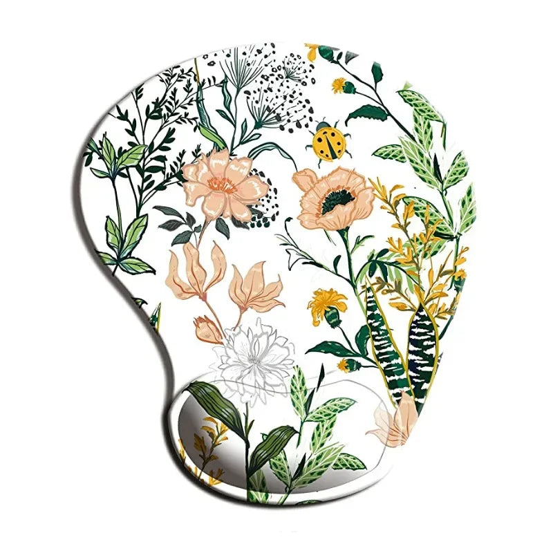Ergonomic mouse pad with wrist rest, white base with green floral leaves and peach flowers