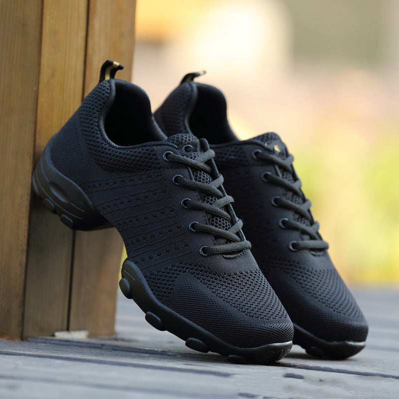 Pair of dark mesh lace-up sports shoes with textured rubber outsole