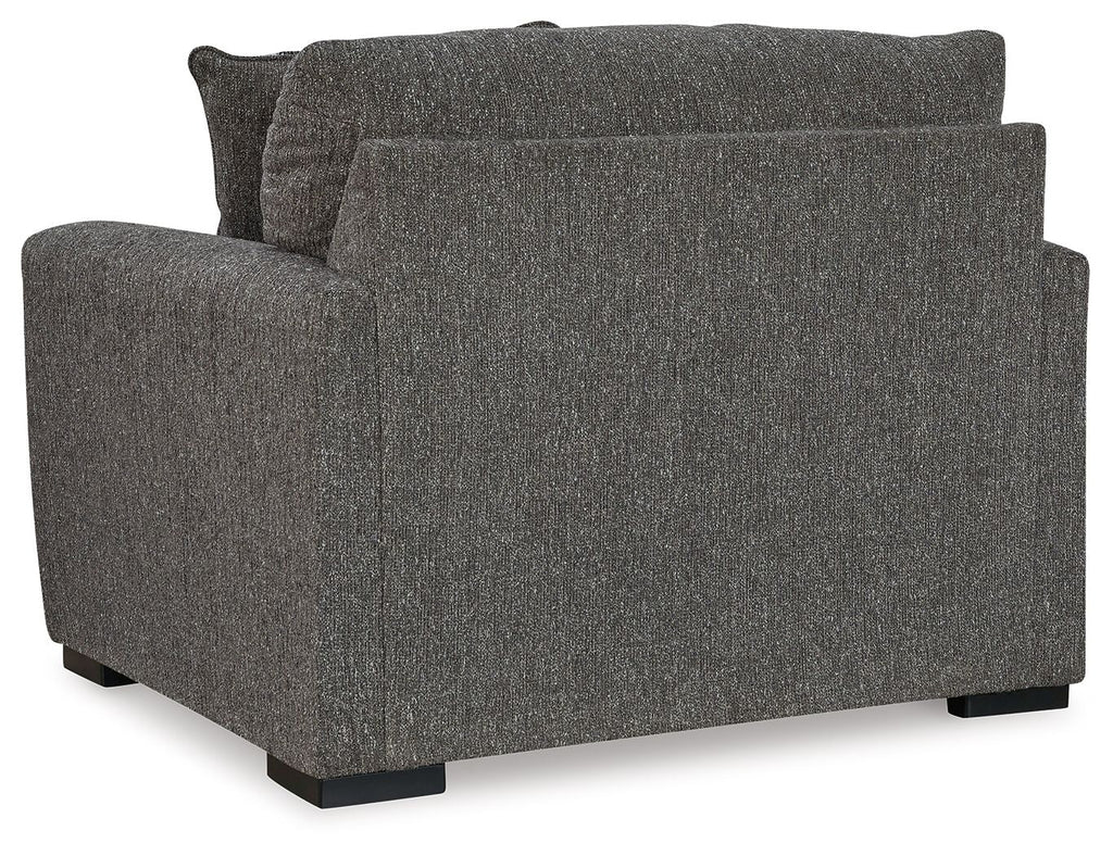 Pewter upholstered chair and a half, side view with tall back and wide armrests