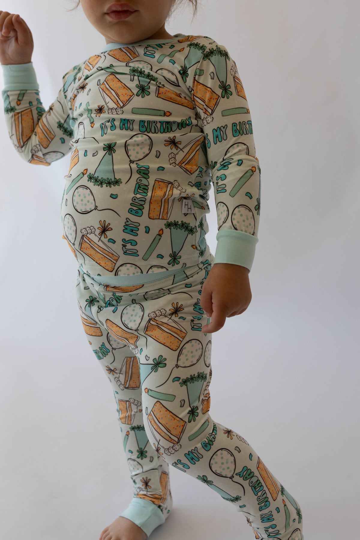 Kids light blue two-piece pajama set with birthday party pattern, long sleeves and pants