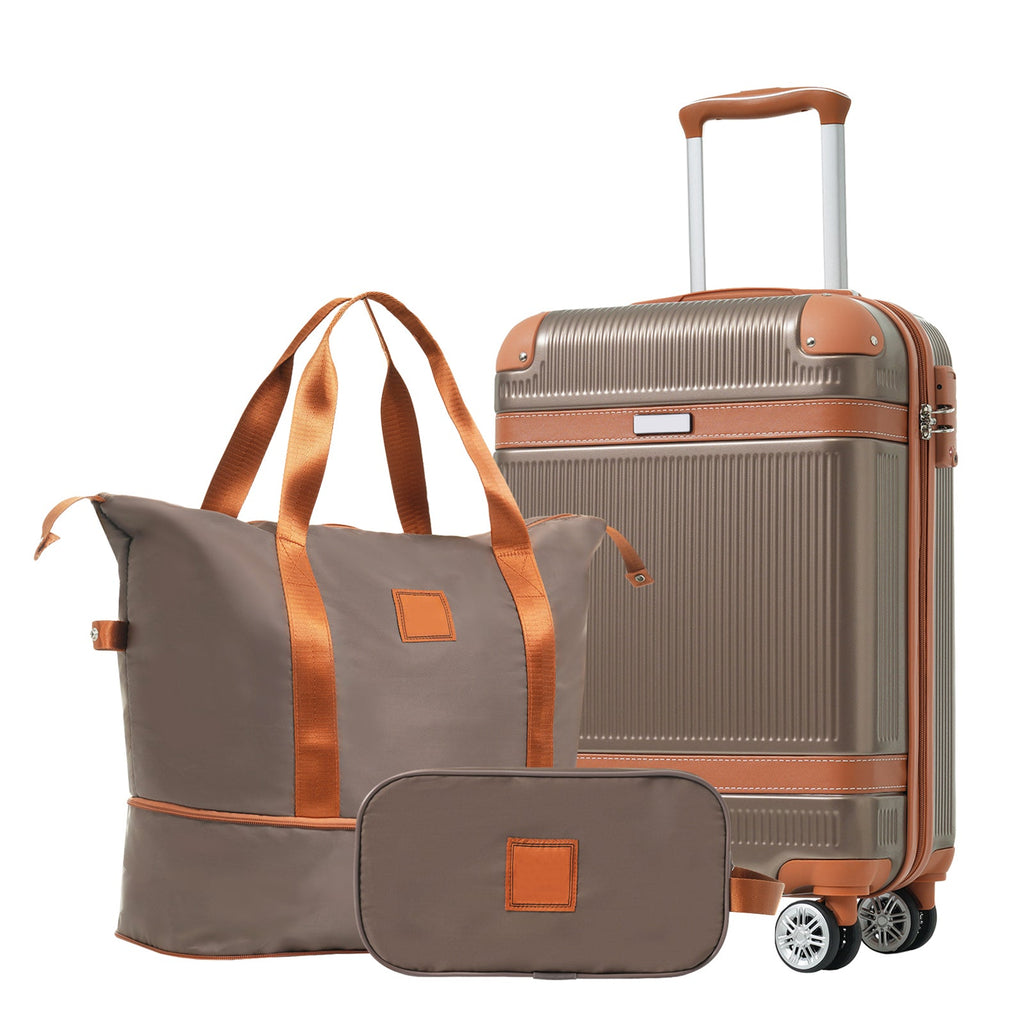 Grey carry-on suitcase with copper-brown trim, paired with duffel bag and organizer pouch