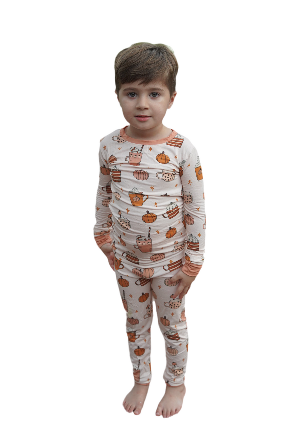 Boys long-sleeve pajama set in cream with orange trim and pumpkin-spice icons
