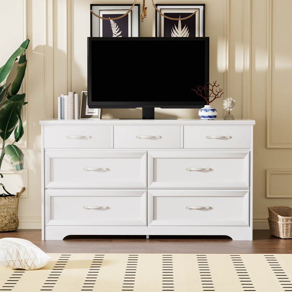 White bedroom dresser with multiple drawers and gold metal pulls, modern panel design