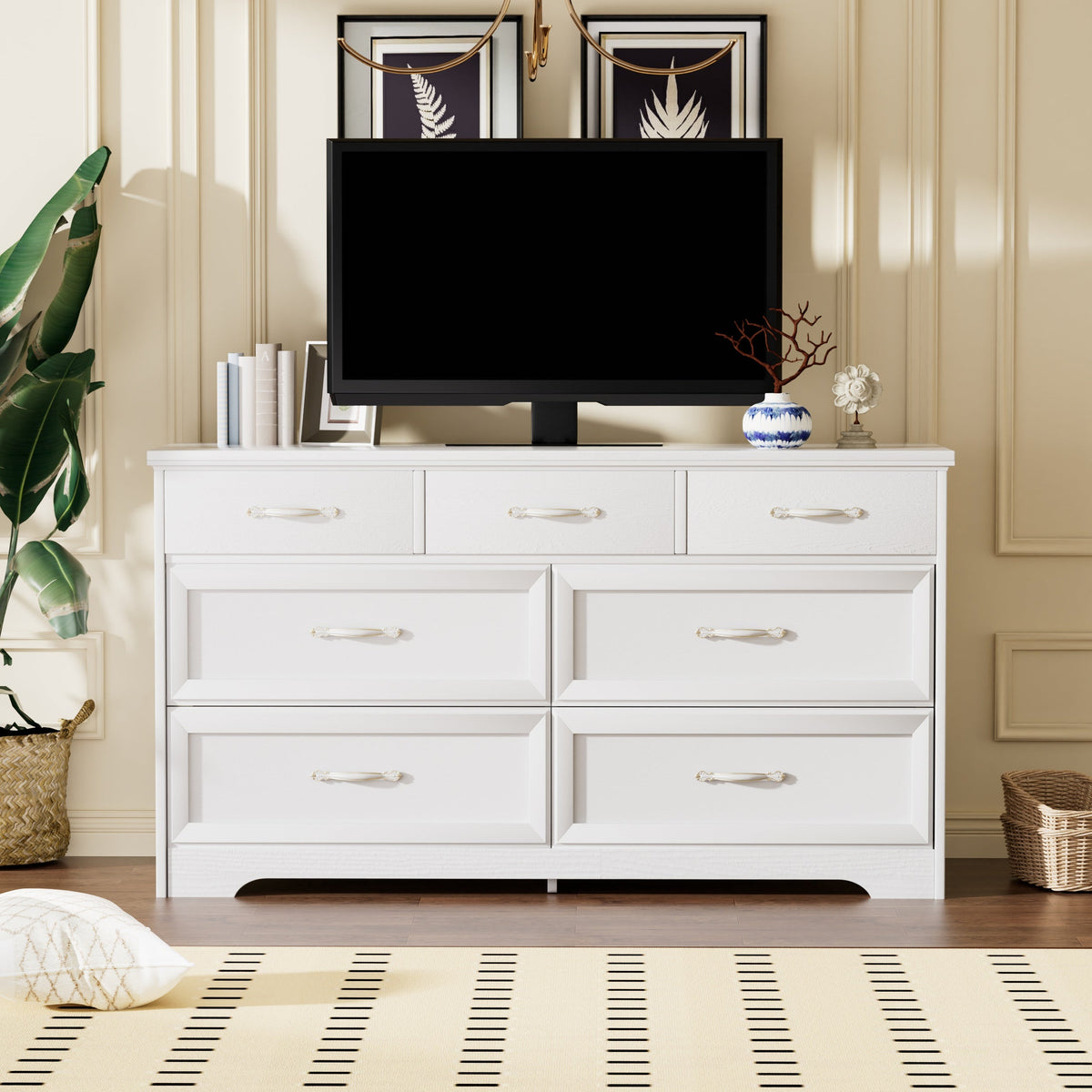 White bedroom dresser with multiple drawers and gold metal pulls, modern panel design