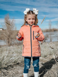 Kids lightweight puffy jacket, peach orange with black zipper and trim