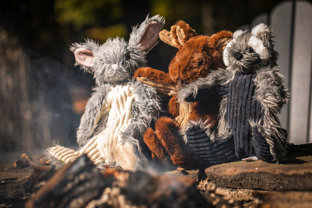 Frayed plush rope dog toy in tan, gray, and dark colors