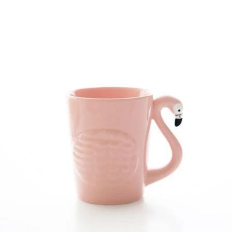 Pink flamingo-style ceramic mug with black beak handle detail
