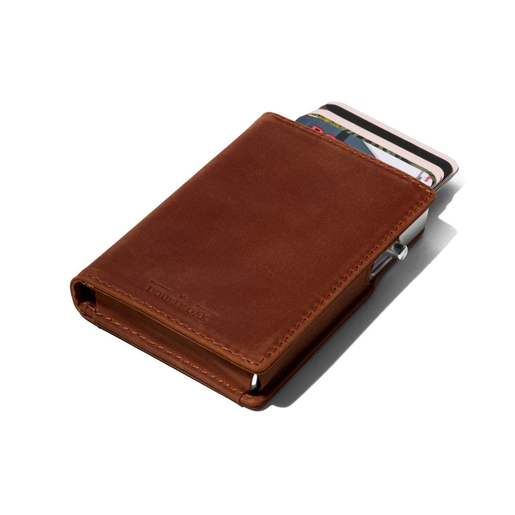 Cognac brown bifold leather wallet with card slots protruding and snap closure
