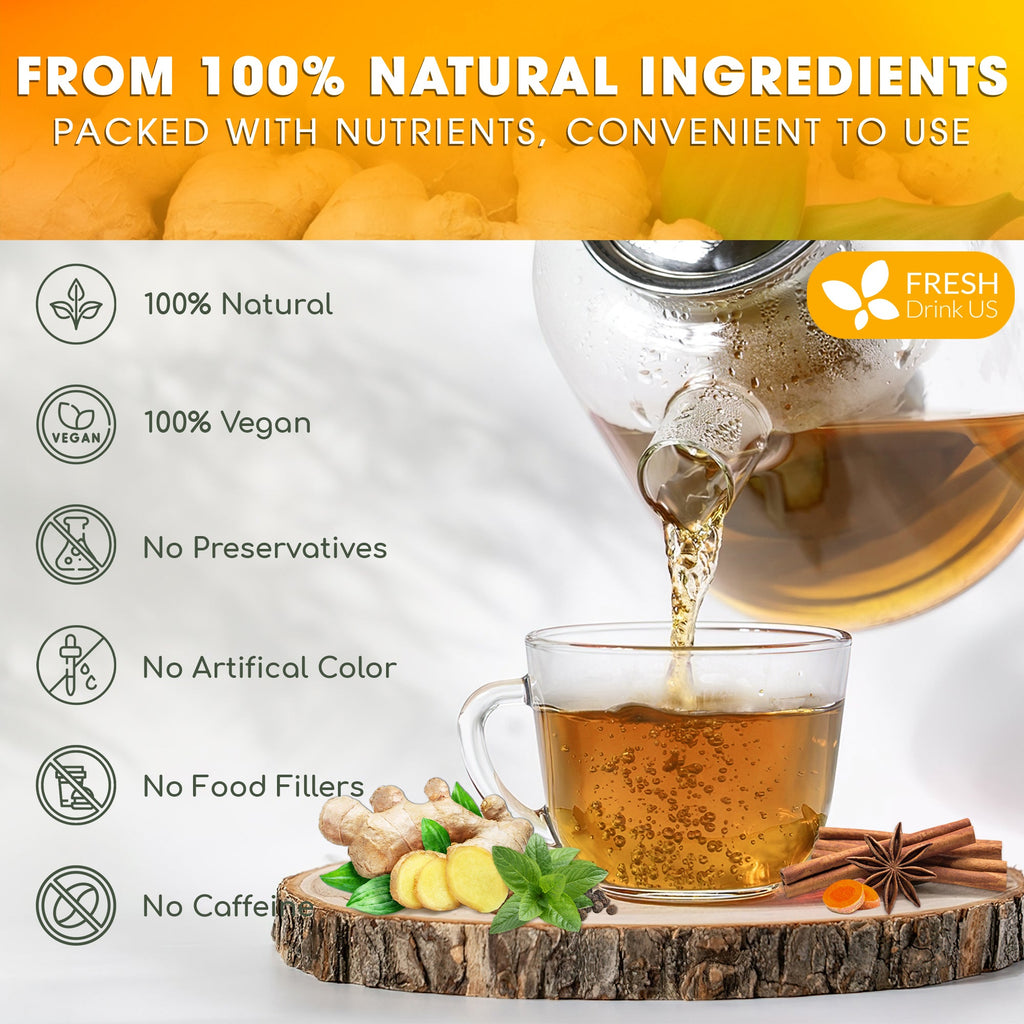 Amber herbal tea in a glass cup with spices and herbs around it