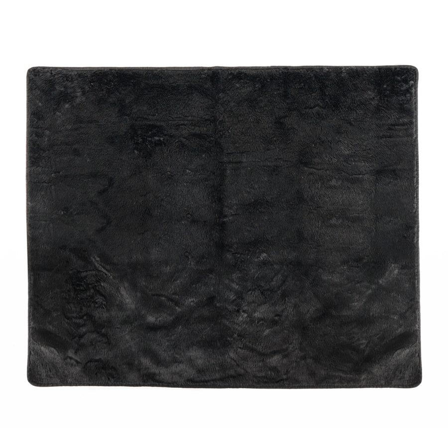 Midnight black faux-fur waterproof throw blanket, close-up of textured surface.