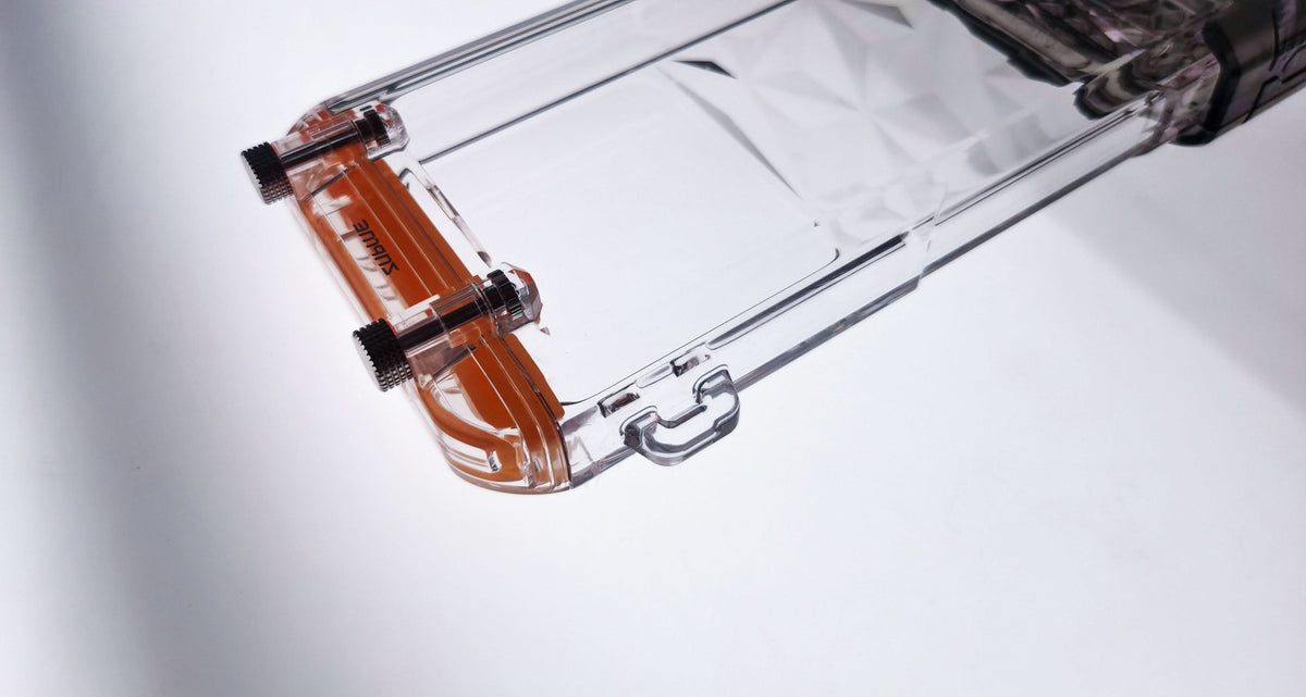 Clear waterproof phone case interior view with orange top seal components