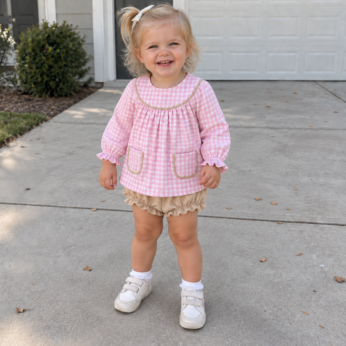 Girls pink gingham top and beige bloomer shorts set with ruffled cuffs and hem