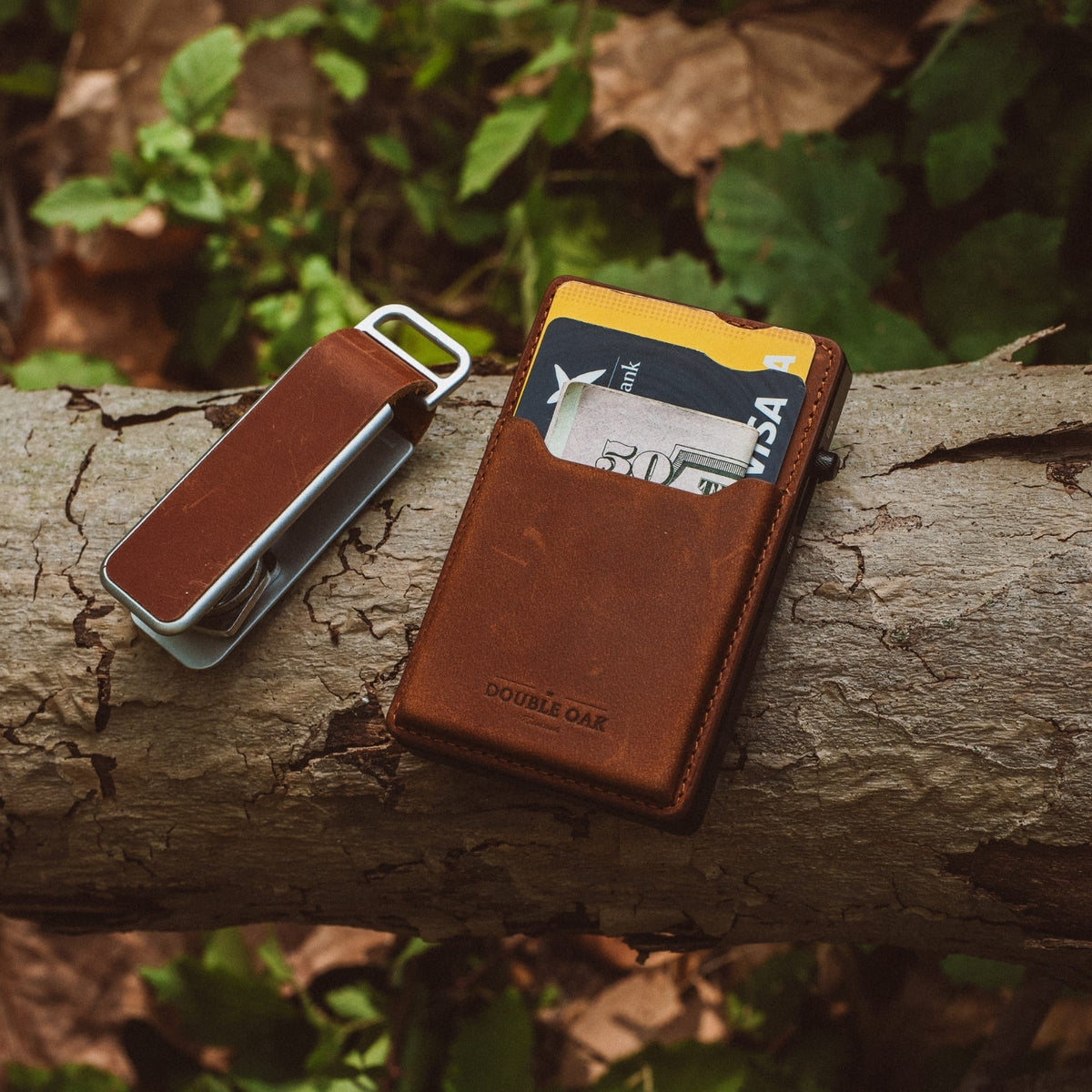 Brown leather mod wallet with visible card in front sleeve and metal attachment
