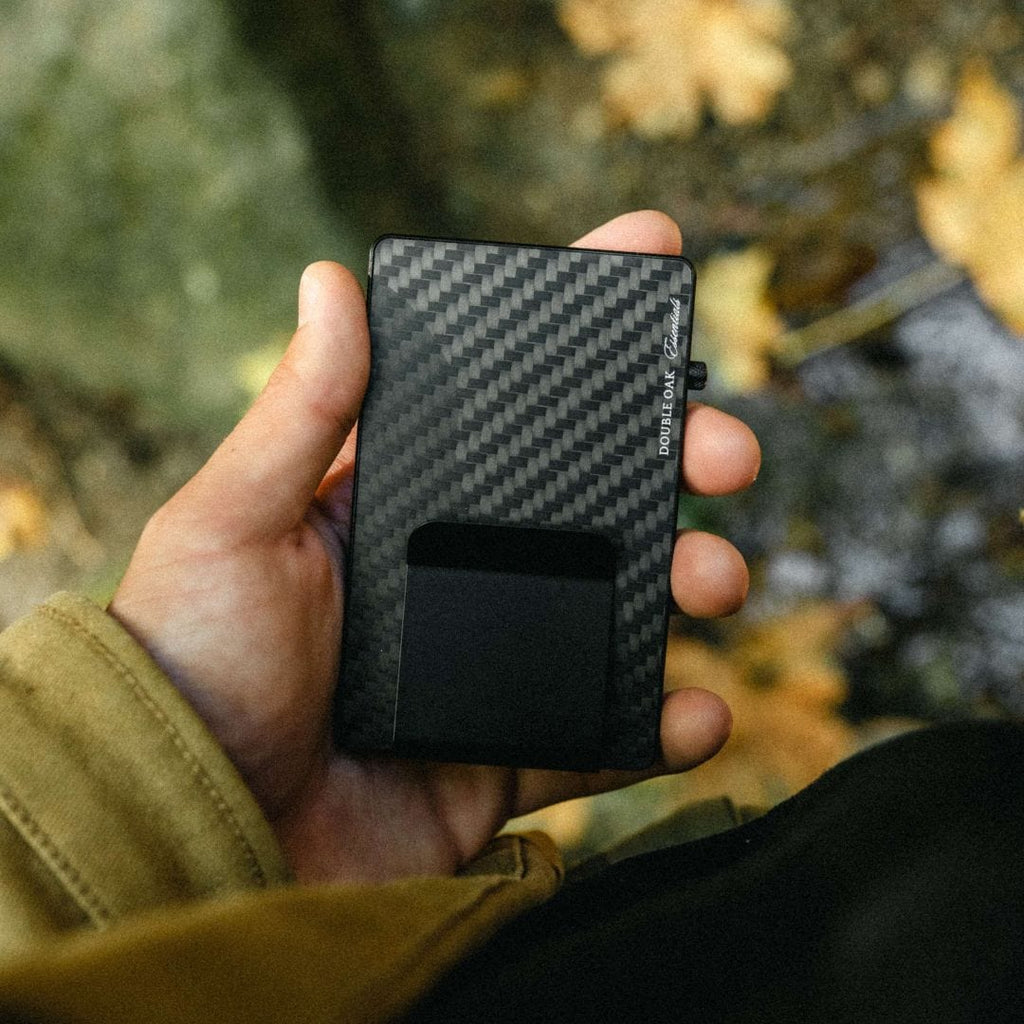 Carbon-fiber pop-up cardholder with a black money clip window