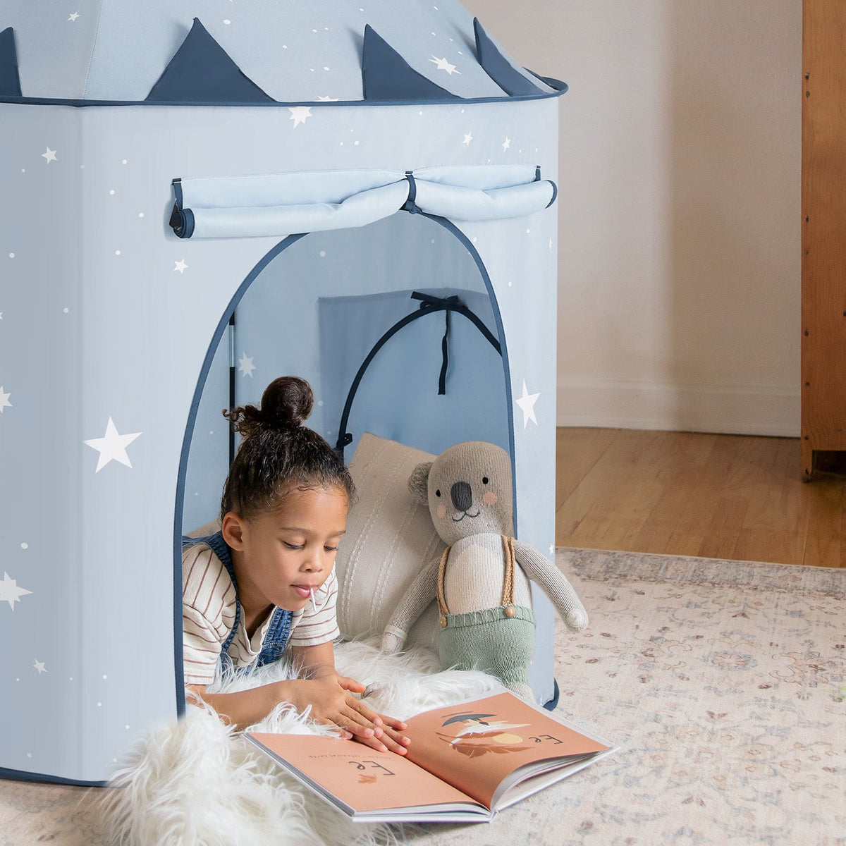 Blue pop-up play tent with open front window and soft side walls for play