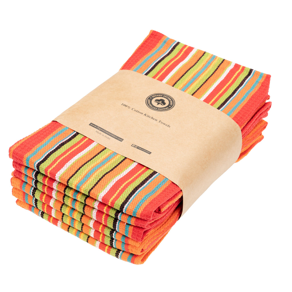 Folded kitchen towels with red, orange, and multicolor stripe pattern; kraft label