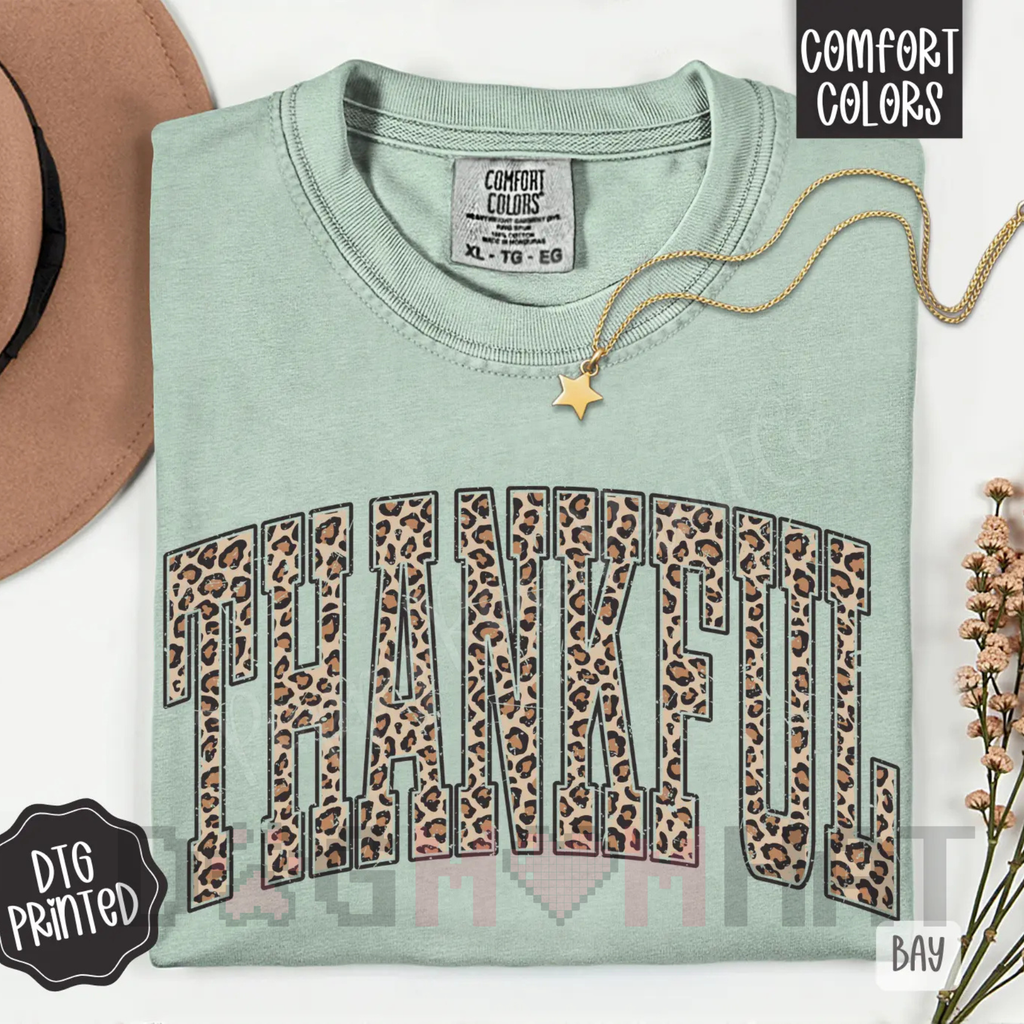 Women’s seafoam T-shirt with leopard-print “Thankful” graphic and gold star pendant