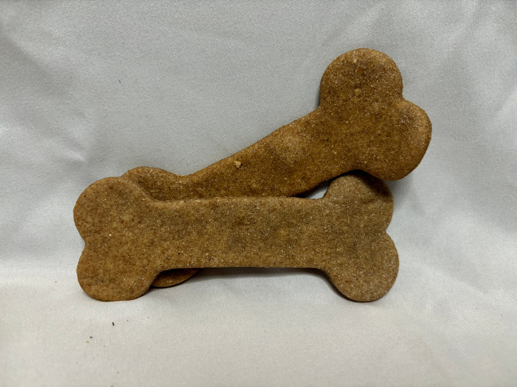 Two large brown bone-shaped dog biscuits stacked together