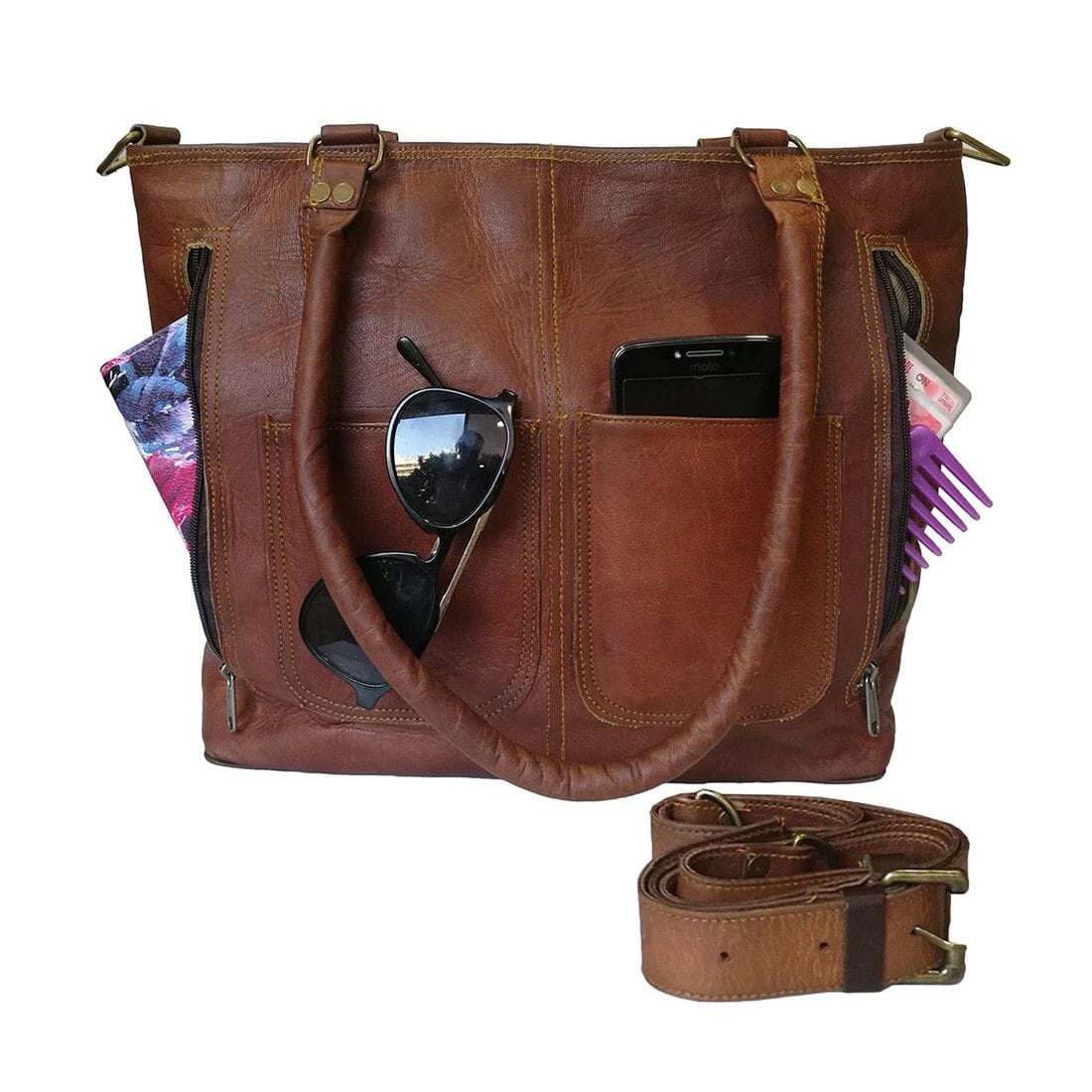 Terry tote bag in brown leather with front zip pockets; phone and sunglasses inside