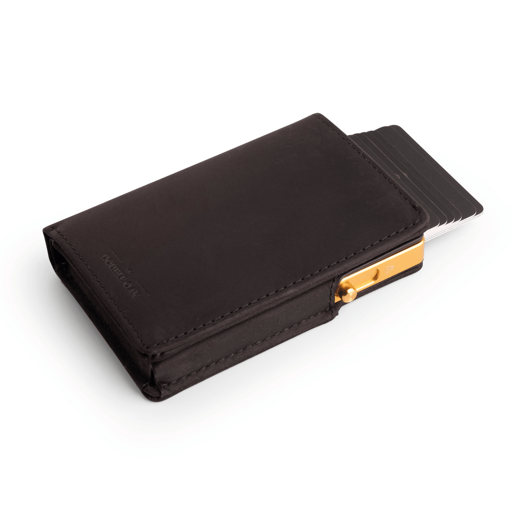 Dark brown leather bifold wallet with gold clasp and card slots, front view.