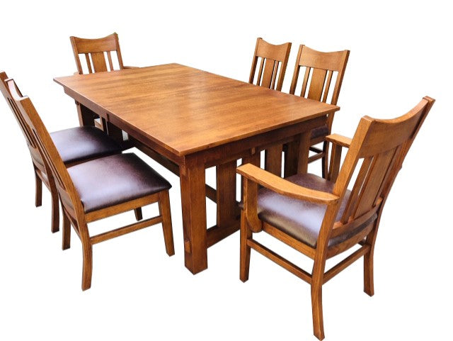 Wood dining set: long rectangular table with four chairs and dark upholstered seats.
