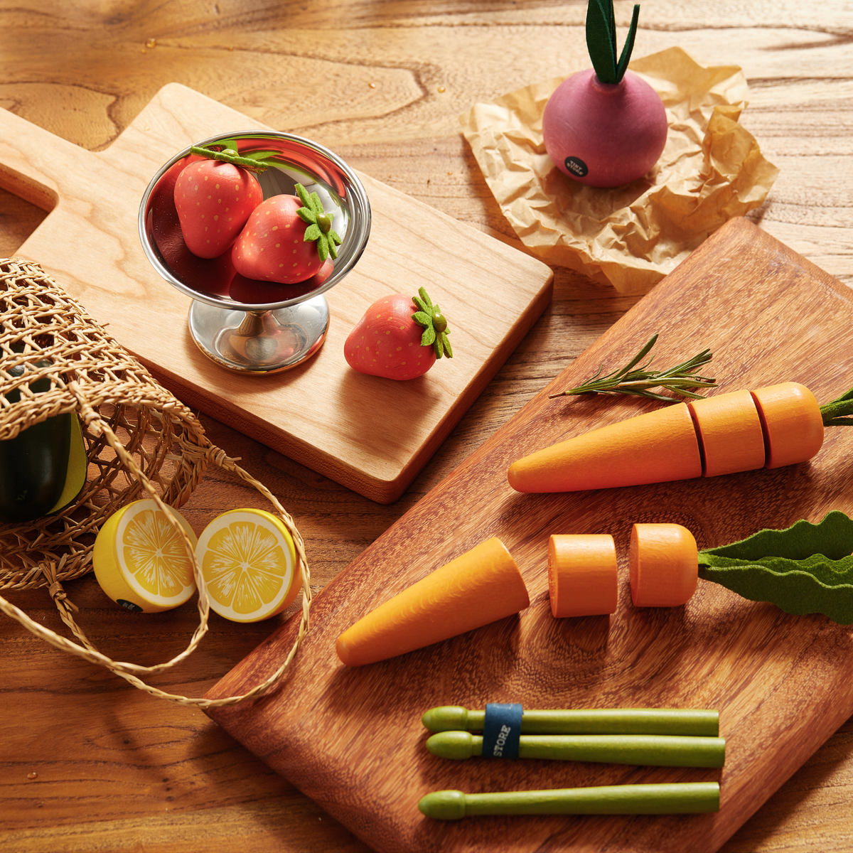 Toy fruit and veggie set with carrot, strawberries, peas, and avocado pieces