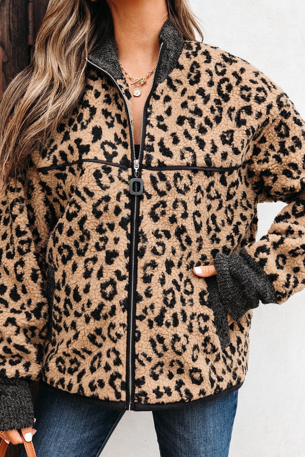 Leopard-print fleece zip-up jacket with stand collar and side pockets, khaki and black.
