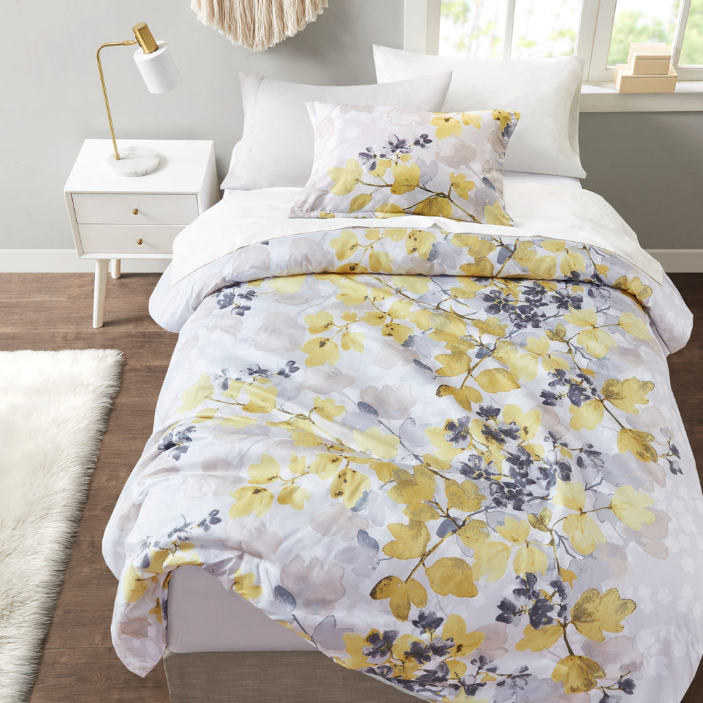 Twin XL comforter set with white bedding and multicolor yellow floral comforter, neatly made