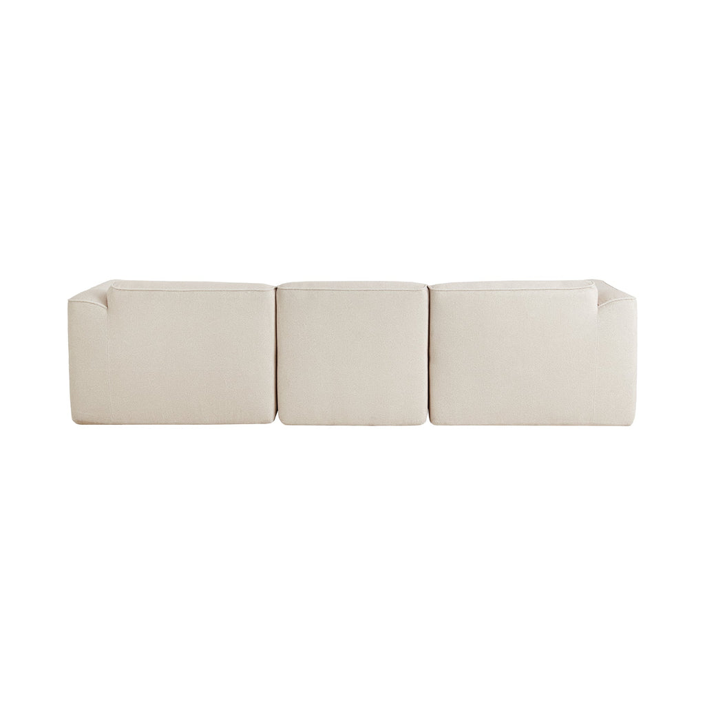 Back view of light beige sectional sofa with cushioned seat sections