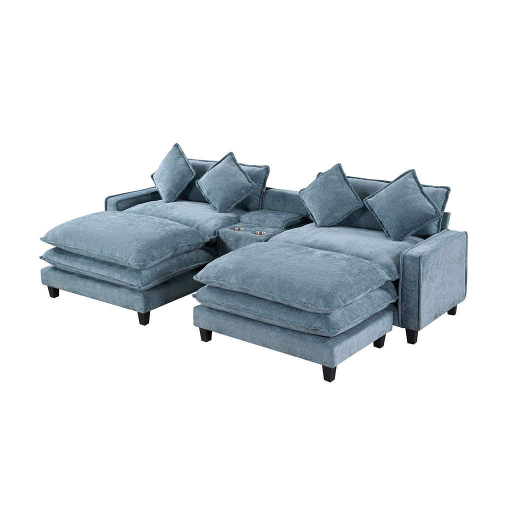 Light blue sectional sofa with two ottomans extended and four accent pillows