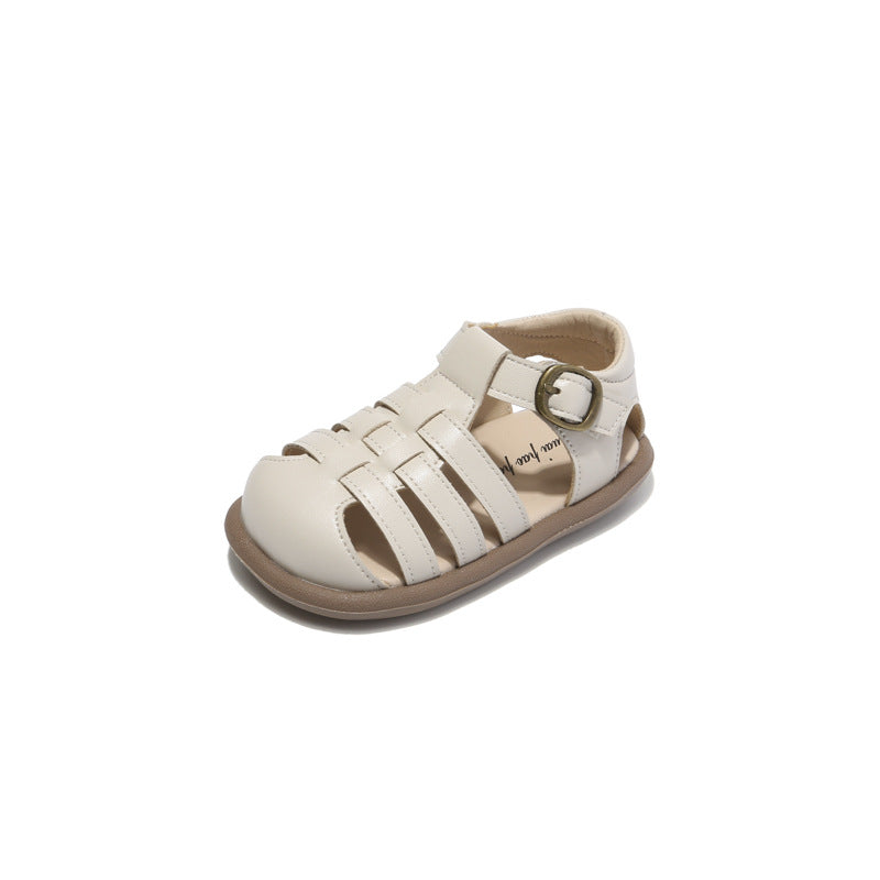 Beige closed-toe toddler woven sandals with hook-and-loop strap and cushioned lining