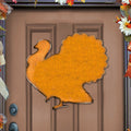 Orange wooden turkey door hanger with scalloped edge and hanging loop