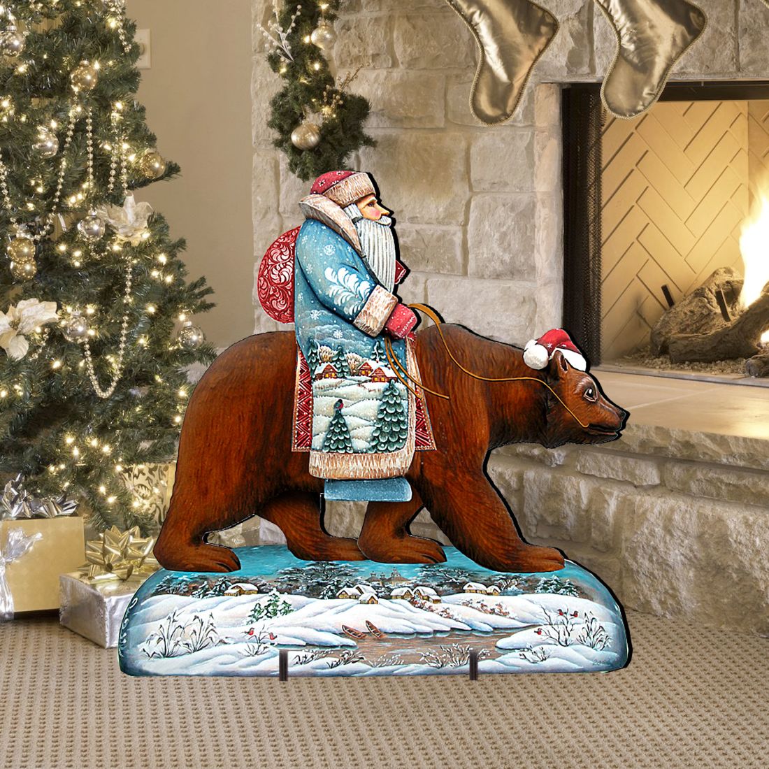 Santa riding a brown grizzly bear holiday outdoor decor piece on a snowy base