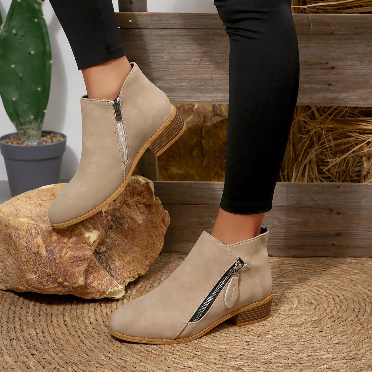 Light beige suede block-heel ankle boots with side zipper and stacked wooden heel