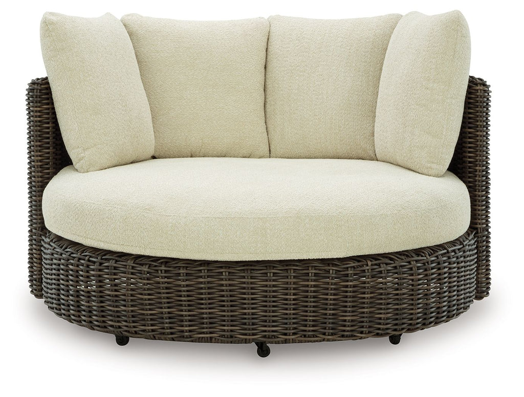 Beige seat and back cushion swivel lounge chair with dark brown wicker frame