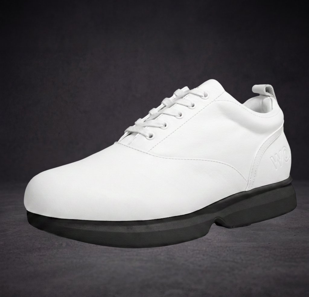 White lace-up sneaker with stitched panels, WOA mark, and black cushioned sole