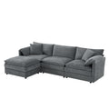 Dark gray modular sectional sofa with movable ottoman and deep cushioned seats