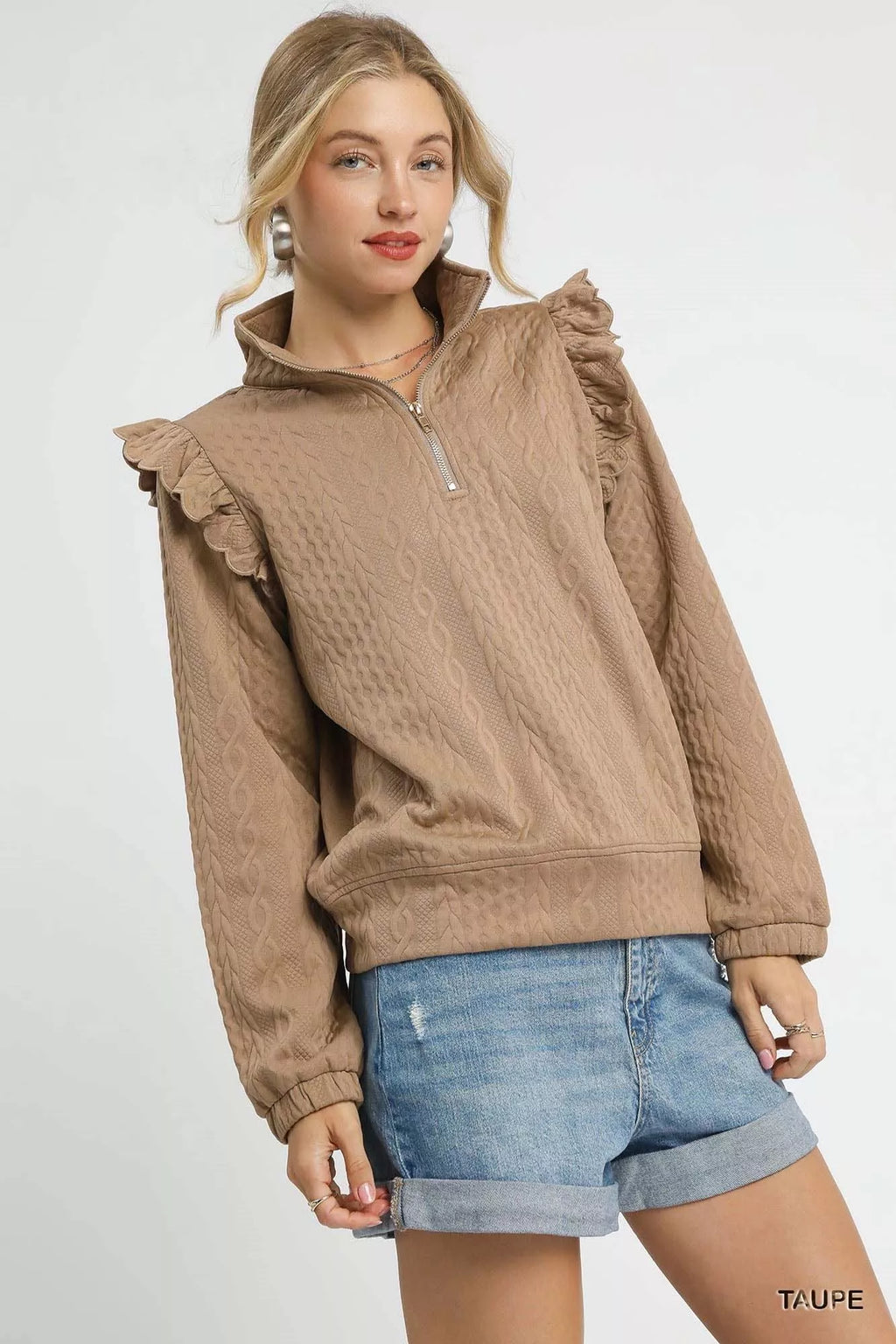 Taupe cable knit pullover with ruffle shoulder detail and half-zip neckline, side view