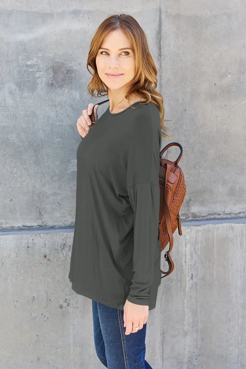 Dark gray long-sleeve relaxed tee with crew neck and subtle drape