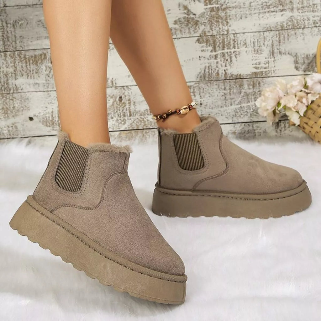 Taupe platform ankle boots with faux fur trim, elastic gore, and cushioned sole