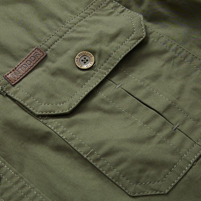Men's work shirt chest pocket detail, olive/khaki fabric, button and stitched seams